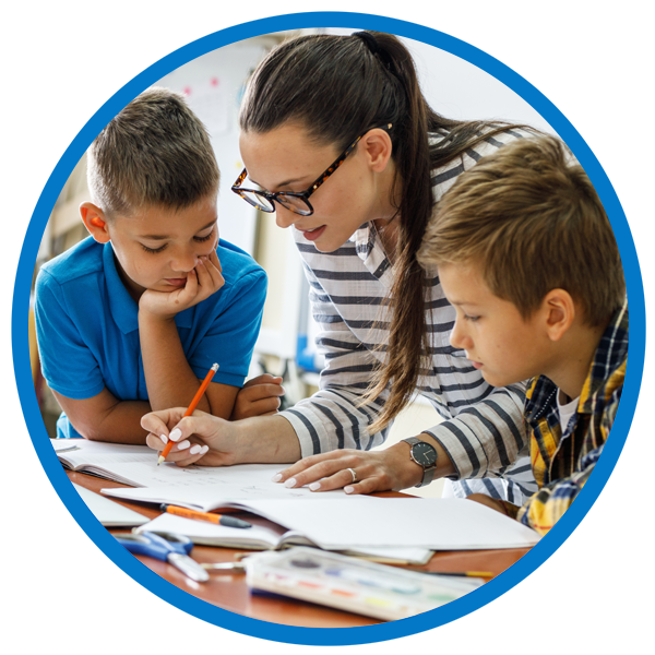Tutor teaching group of children